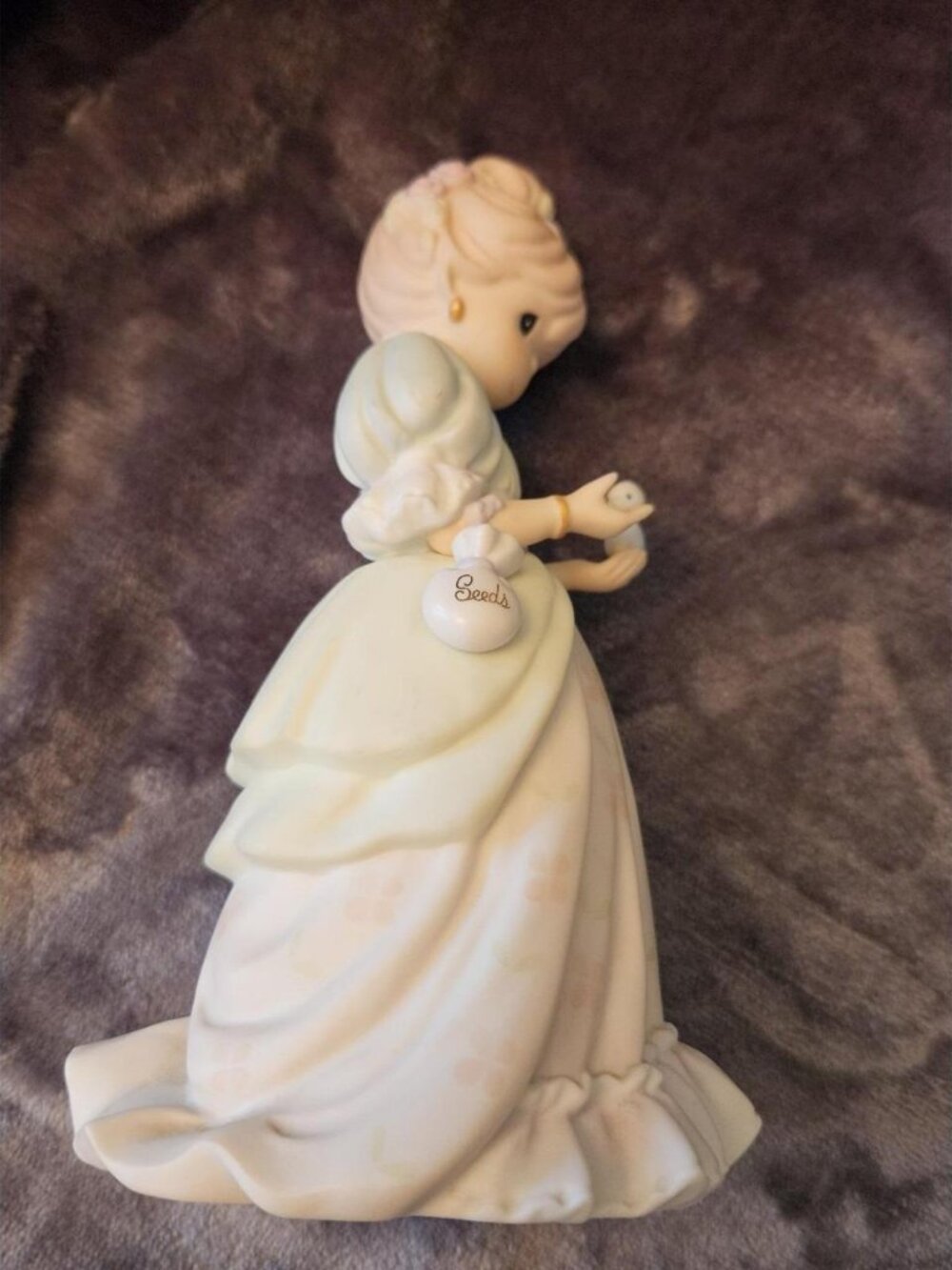Vintage Girl with Bird & "Bonds" Bag Ceramic Figurine